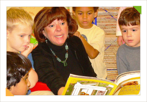 Educational consulting expert Kim Hughes engages the active attention of a group of preschoolers